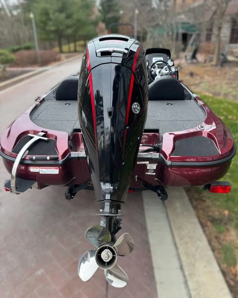 Slide: The Image of 2025 Nitro Z17 boat with powerful outboard motor, parked on a paved road. - 3