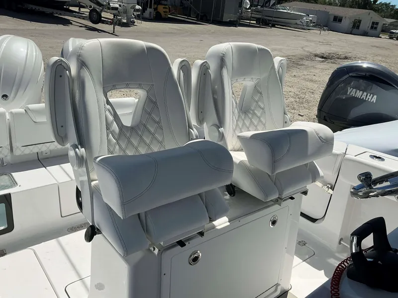 Slide: The Image of Luxury seating on a 2025 Sportsman 261 Heritage boat, featuring white cushioned seats. - 11
