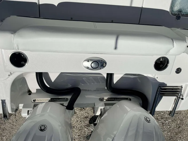 Slide: The Image of 2025 Sportsman 261 Heritage boat with dual Yamaha engines and sleek white interior. - 12