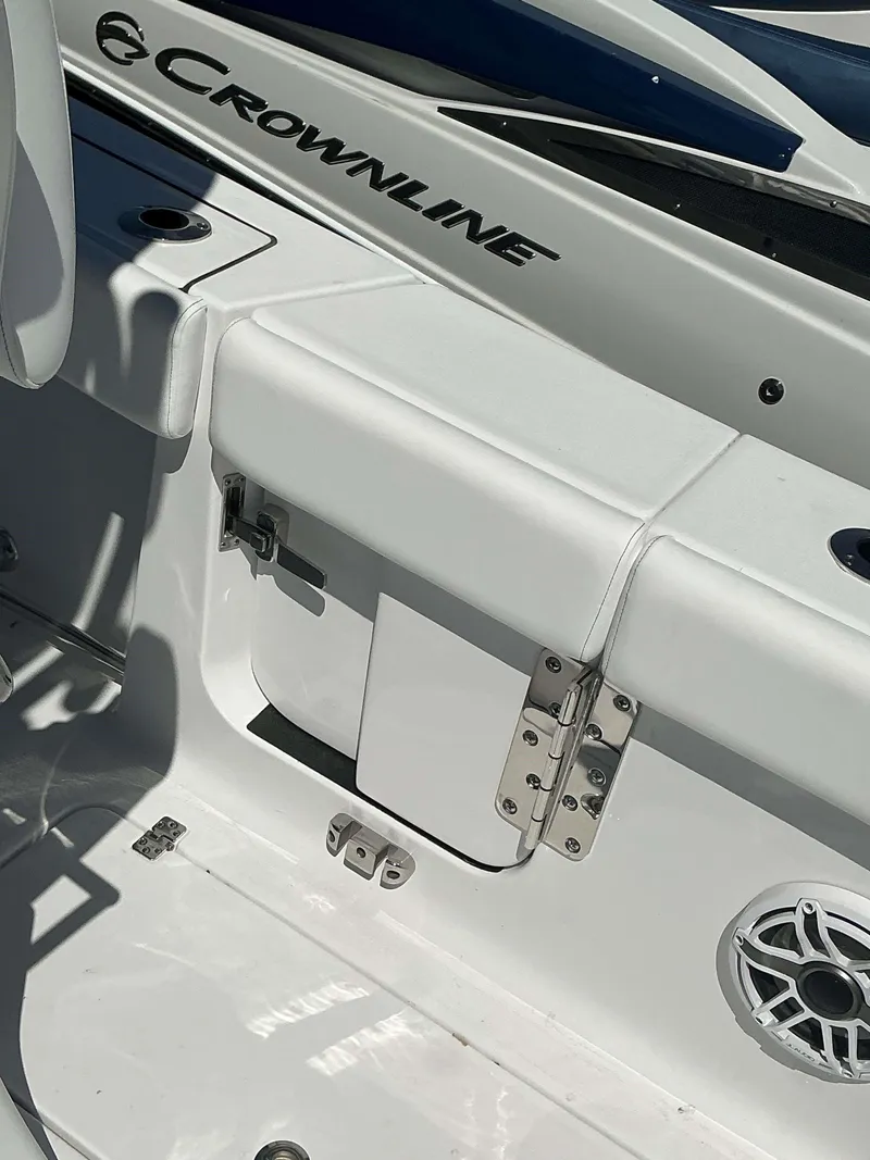 Slide: The Image of 2025 Sportsman 261 Heritage boat interior with white seating and Crownline branding. - 13