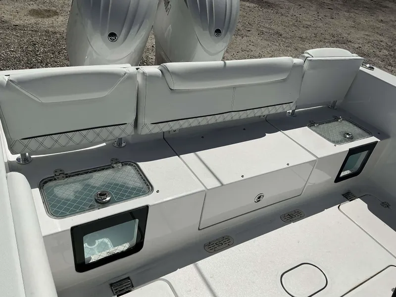 Slide: The Image of 2025 Sportsman 261 Heritage boat interior with seating and storage compartments. - 15