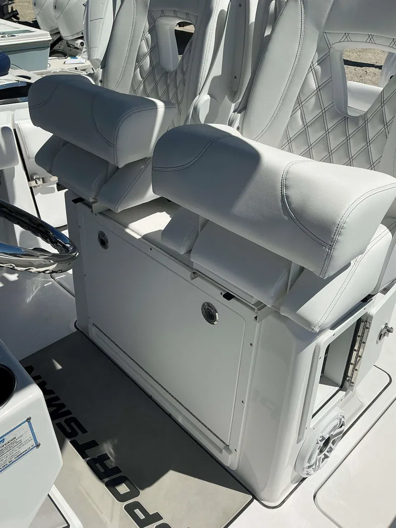 Slide: The Image of 2025 Sportsman 261 Heritage boat seats with white upholstery and diamond stitching. - 19