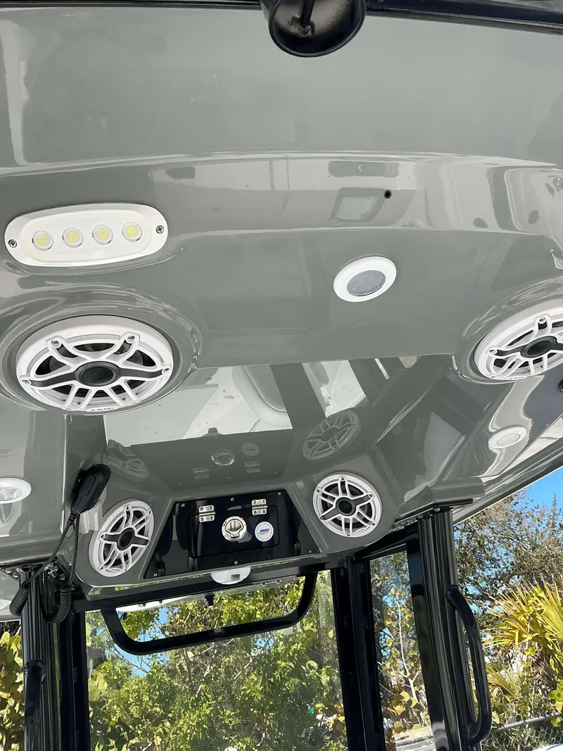 Slide: The Image of 2025 Sportsman 261 Heritage boat console with speakers and LED lights. - 4