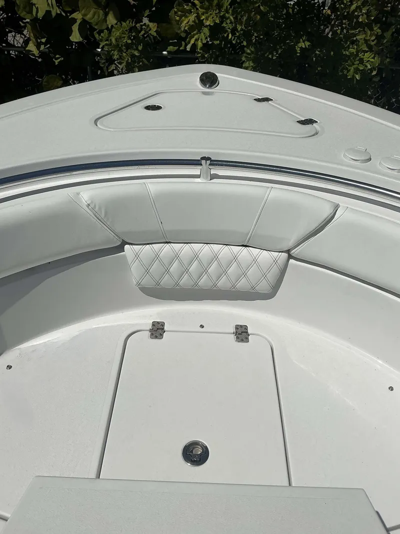 Slide: The Image of Interior view of 2025 Sportsman 261 Heritage boat, featuring white cushioned seating. - 6