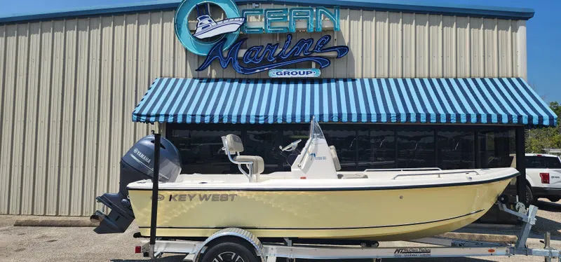 Slide: The Image of 2024 Key West 1720CC boat displayed at Ocean Marine Group dealership. - 1
