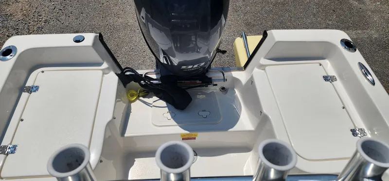 Slide: The Image of 2024 Key West 1720CC boat stern with motor and rod holders. - 17