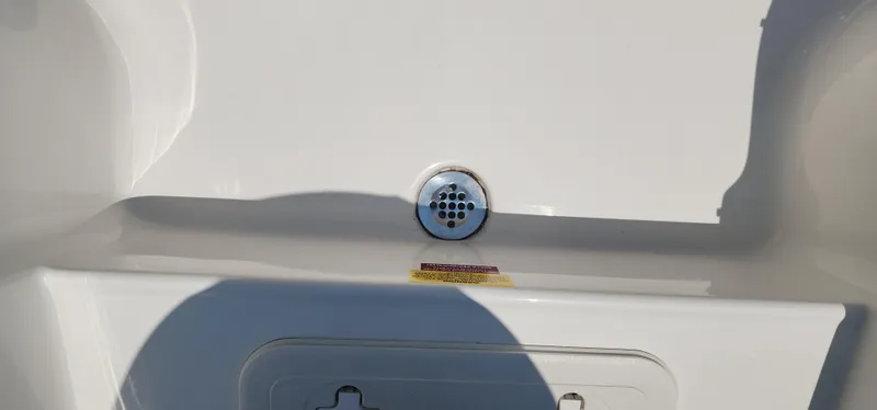 Slide: The Image of 2024 Key West 1720CC boat drain detail with shadow. - 19