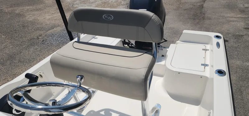Slide: The Image of 2024 Key West 1720CC boat interior with steering wheel and seating. - 20