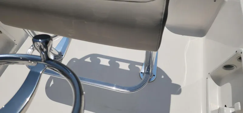 Slide: The Image of 2024 Key West 1720CC boat interior with chrome and beige seating. - 21