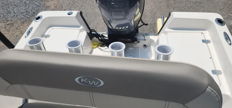 Slide: The Image of 2024 Key West 1720CC boat interior with motor and rod holders. - 22