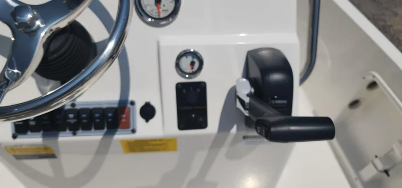 Slide: The Image of Close-up of 2024 Key West 1720CC boat controls and steering wheel. - 25