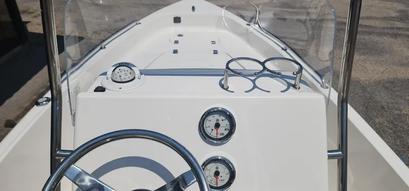 Slide: The Image of 2024 Key West 1720CC boat dashboard with steering wheel and gauges. - 26