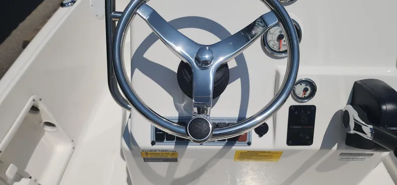 Slide: The Image of 2024 Key West 1720CC boat steering wheel and dashboard controls. - 27