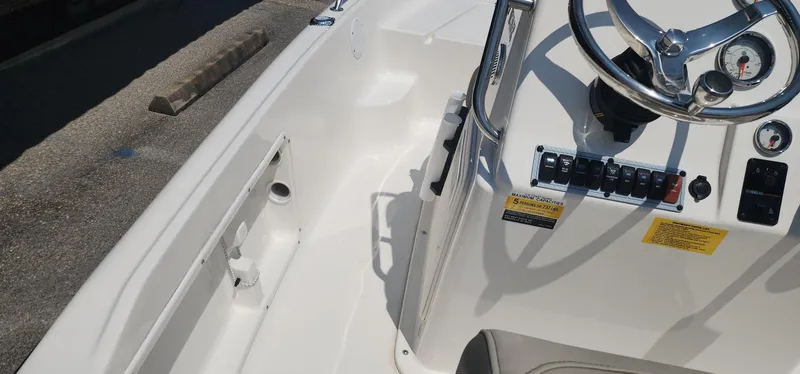 Slide: The Image of 2024 Key West 1720CC boat console with steering wheel and control panel. - 29