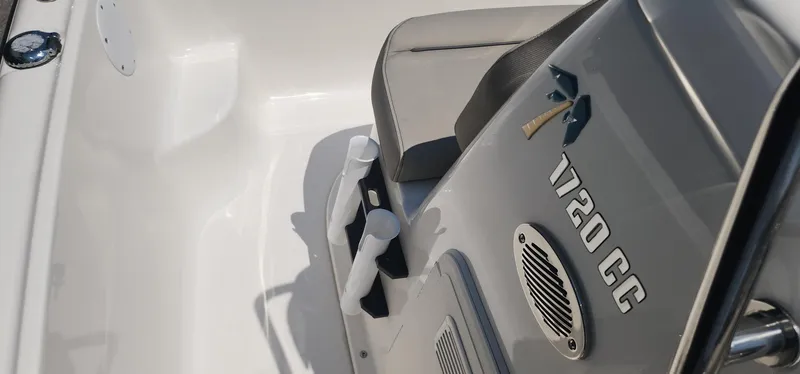 Slide: The Image of 2024 Key West 1720CC boat interior with seating and console details. - 32