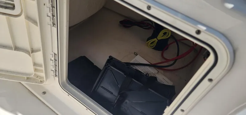 Slide: The Image of 2024 Key West 1720CC boat storage compartment with wiring and equipment. - 34