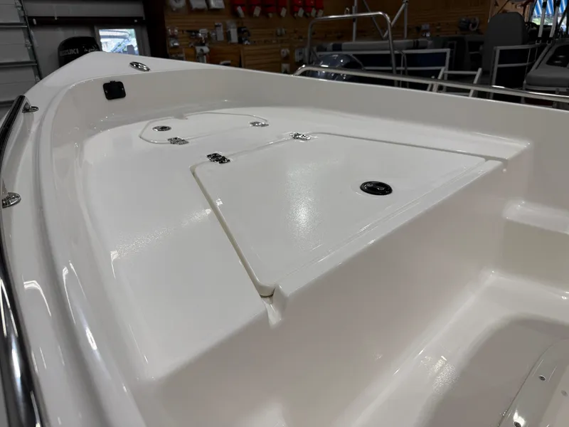 Slide: The Image of 2025 Key West 1720CC boat interior, featuring sleek white deck design. - 10