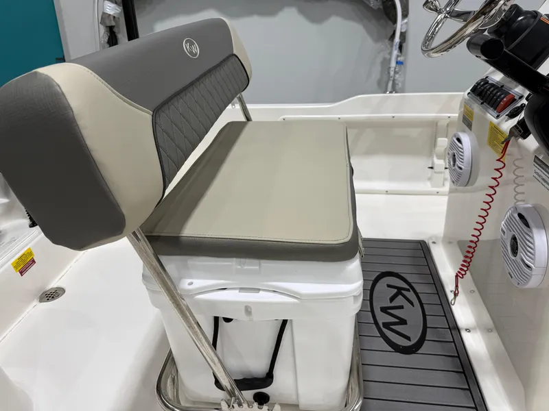 Slide: The Image of 2025 Key West 1720CC boat interior with cushioned seating and steering console. - 14