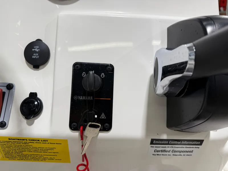 Slide: The Image of 2025 Key West 1720CC boat dashboard with Yamaha ignition and USB input. - 17