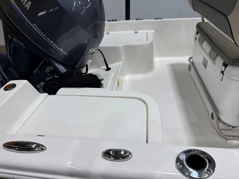 Slide: The Image of 2025 Key West 1720CC boat interior with Yamaha engine and seating area. - 21