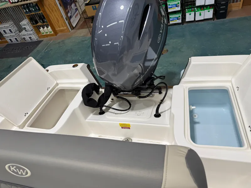 Slide: The Image of 2025 Key West 1720CC boat interior with Yamaha motor and storage compartments. - 22
