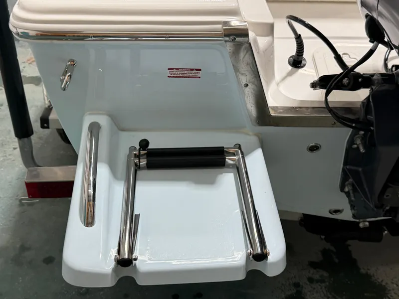 Slide: The Image of 2025 Key West 1720CC boat swim platform with foldable ladder and motor mount. - 25