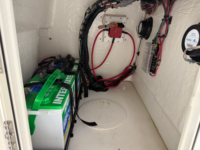 Slide: The Image of 2025 Key West 1720CC boat battery compartment with wiring and components. - 28