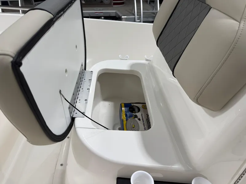 Slide: The Image of 2025 Key West 1720CC boat seat storage compartment with open lid. - 29