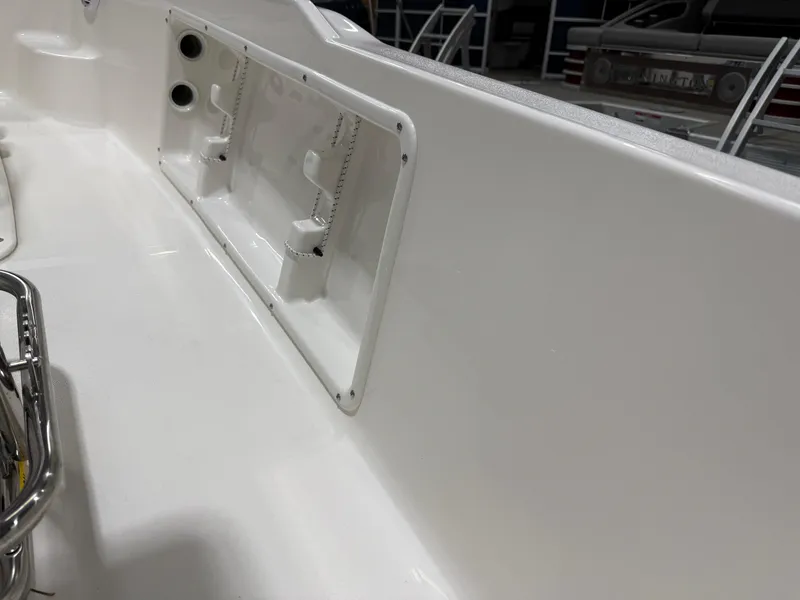 Slide: The Image of 2025 Key West 1720CC boat interior detail, featuring sleek white paneling and fixtures. - 30