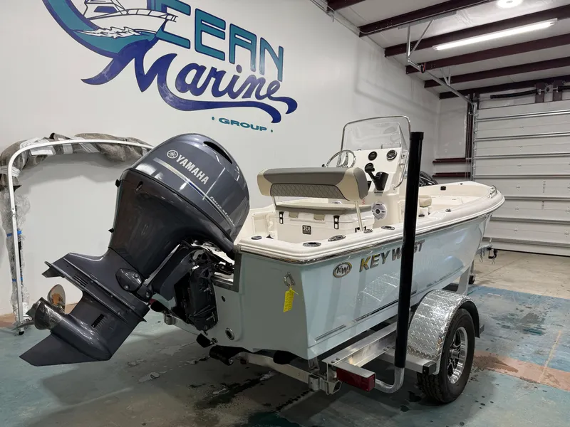 Slide: The Image of 2025 Key West 1720CC boat with Yamaha outboard motor in a garage. - 5