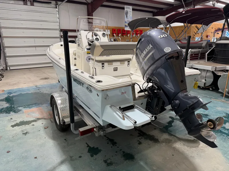 Slide: The Image of 2025 Key West 1720CC boat with Yamaha 90 engine in a showroom. - 7