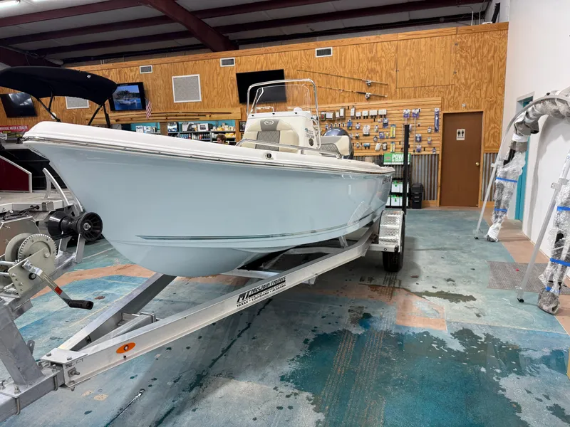 Slide: The Image of 2025 Key West 1720CC boat on trailer in showroom. - 8