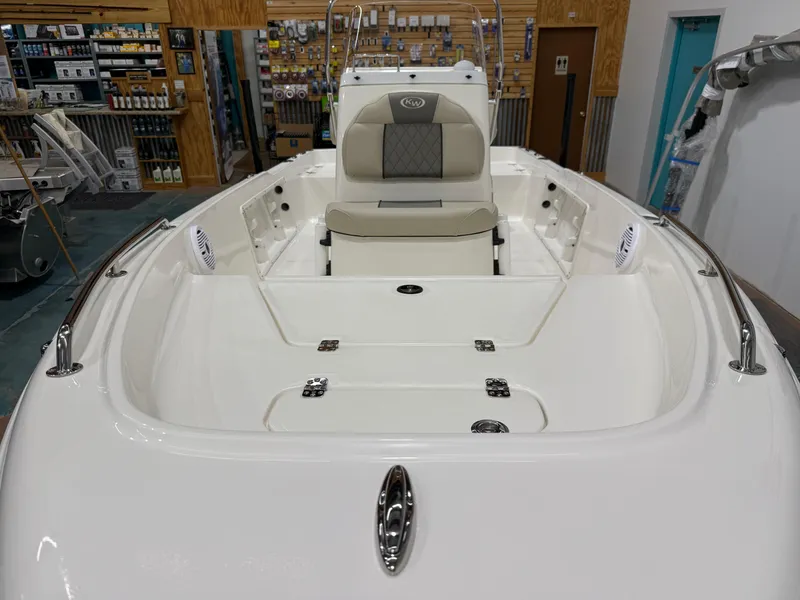 Slide: The Image of 2025 Key West 1720CC boat interior with seating and storage compartments. - 9