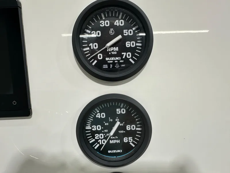 Slide: The Image of 2024 Key West 189FS boat gauges, displaying RPM and speed in MPH and km/h. - 18