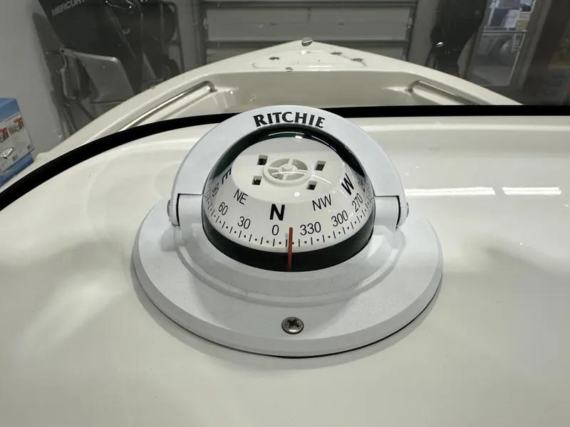Slide: The Image of Ritchie compass on 2024 Key West 189FS boat dashboard. - 21