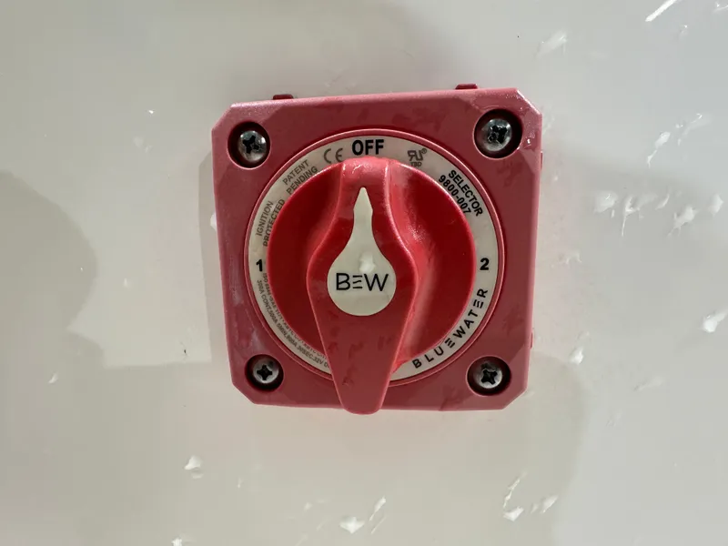 Slide: The Image of Red battery switch on 2024 Key West 189FS boat. - 23