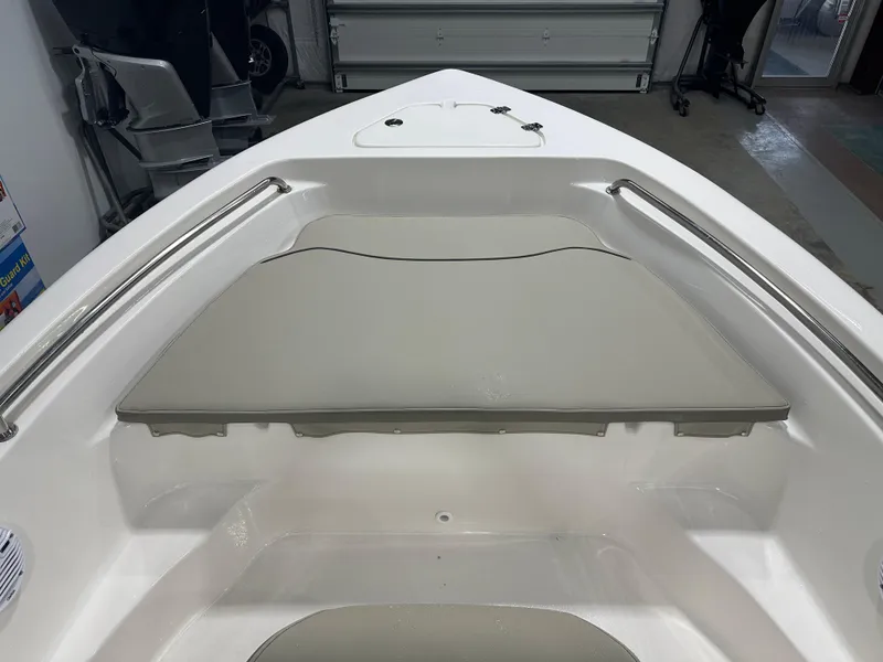 Slide: The Image of 2024 Key West 189FS boat interior with cushioned seating and stainless steel rails. - 24