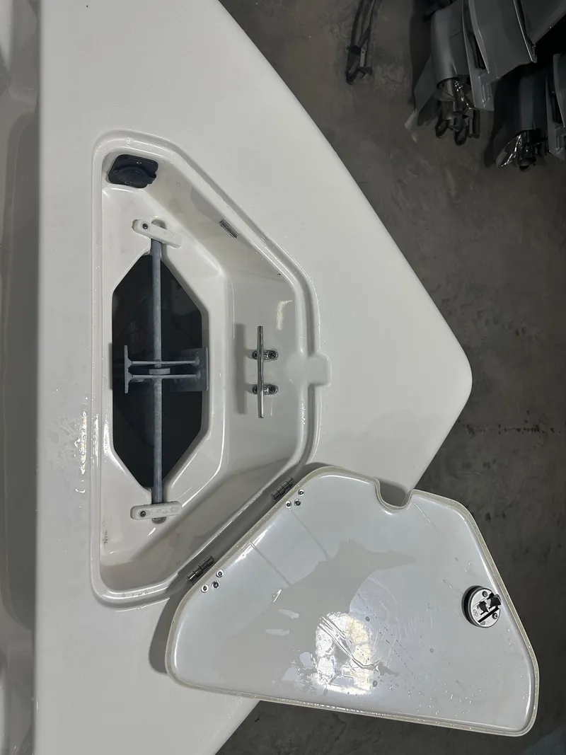Slide: The Image of Open anchor locker on 2024 Key West 189FS boat, showcasing storage compartment. - 25