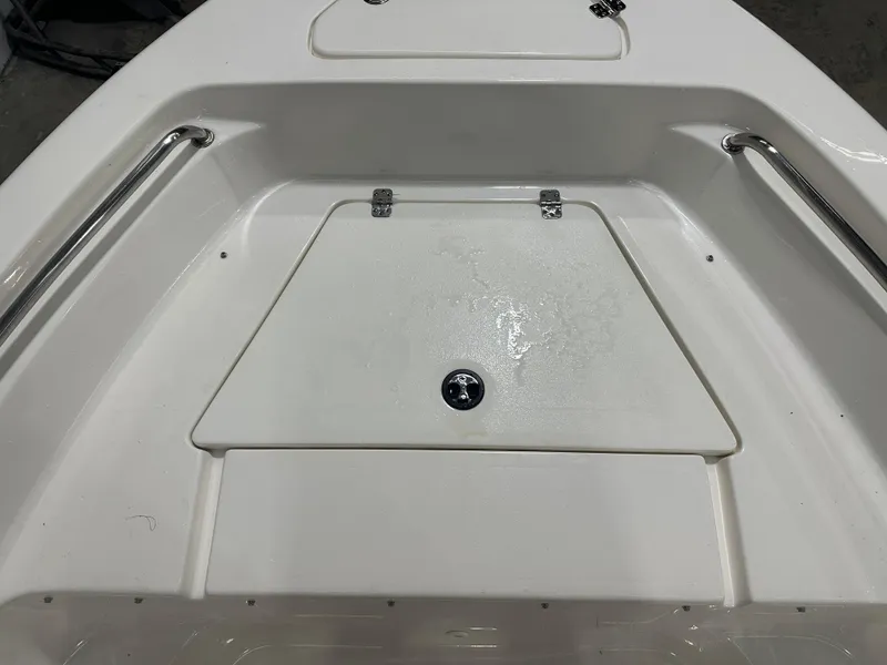 Slide: The Image of 2024 Key West 189FS boat interior with storage compartment and stainless steel rails. - 26