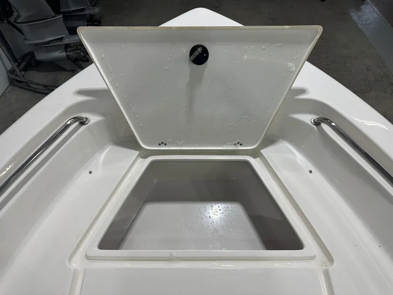 Slide: The Image of 2024 Key West 189FS boat storage compartment with open hatch, showcasing interior space. - 27