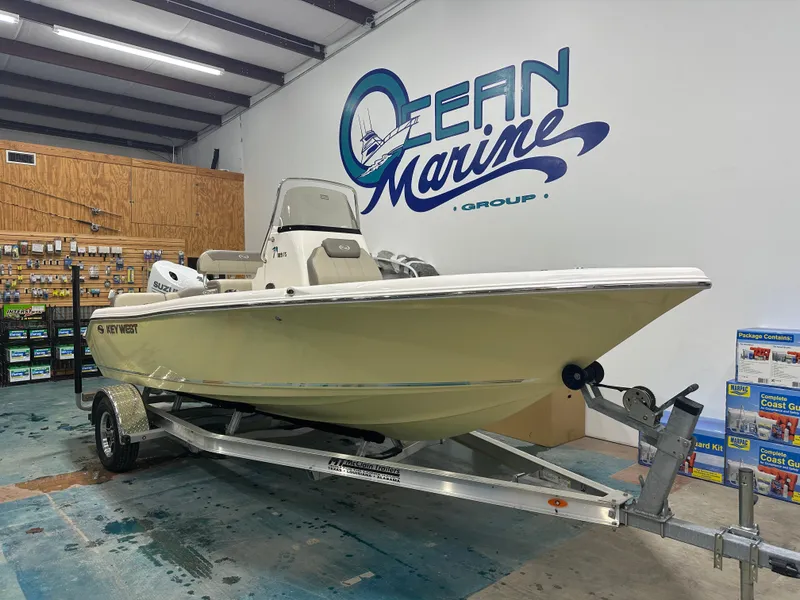 Slide: The Image of 2024 Key West 189FS boat on trailer in showroom, Ocean Marine Group. - 3