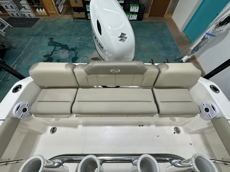 Slide: The Image of 2024 Key West 189FS boat interior with beige seating and cup holders. - 30