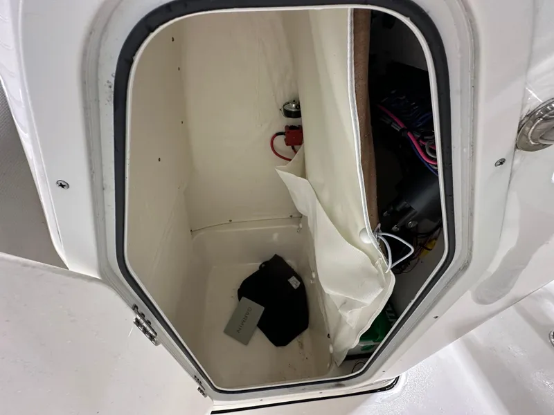 Slide: The Image of 2024 Key West 189FS boat storage compartment with wiring and accessories. - 31
