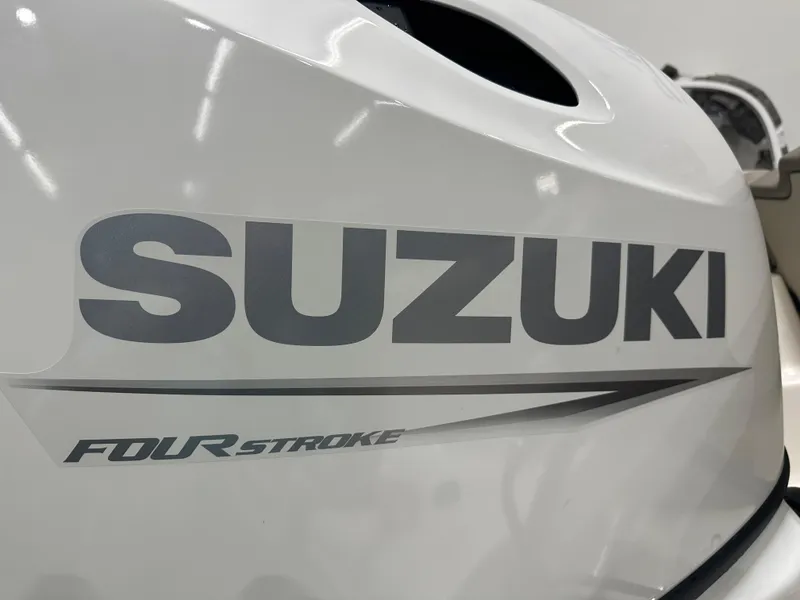 Slide: The Image of Close-up of Suzuki four-stroke engine on 2024 Key West 189FS boat. - 34