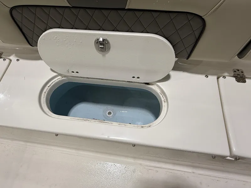 Slide: The Image of Open storage compartment on 2025 Key West 189FS boat. - 12