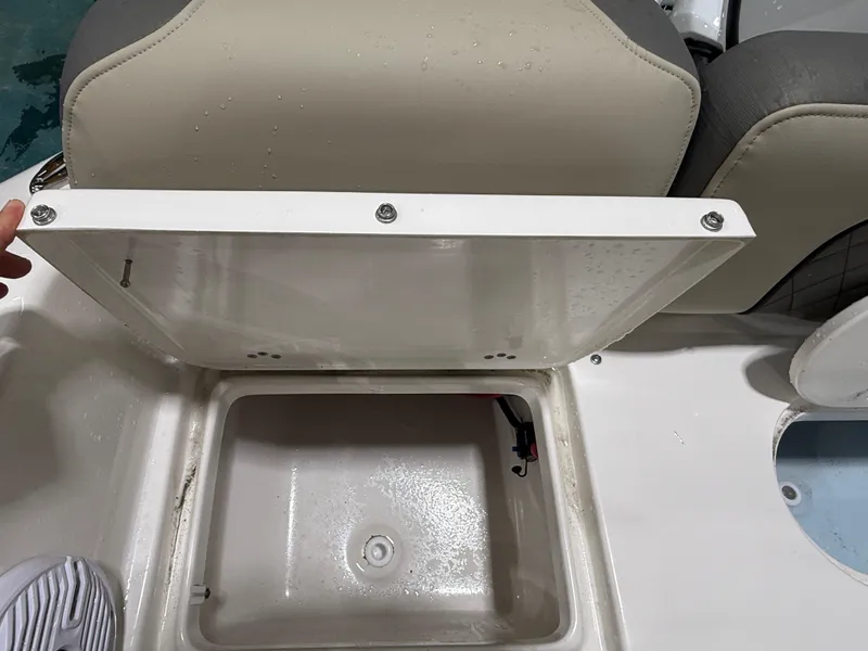 Slide: The Image of Open storage compartment on 2025 Key West 189FS boat, showing interior details. - 13