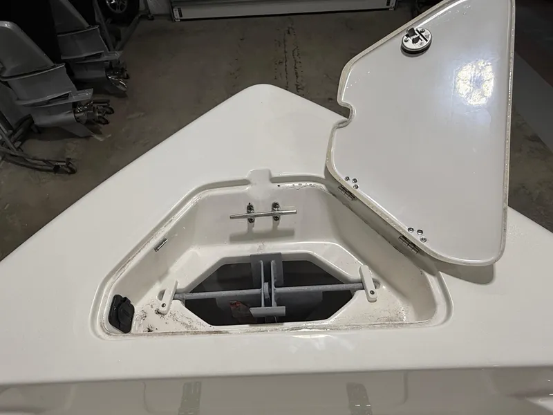 Slide: The Image of Open anchor compartment on 2025 Key West 189FS boat, showcasing storage space. - 16