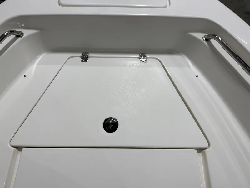 Slide: The Image of 2025 Key West 189FS boat interior with storage compartment and stainless steel handles. - 17