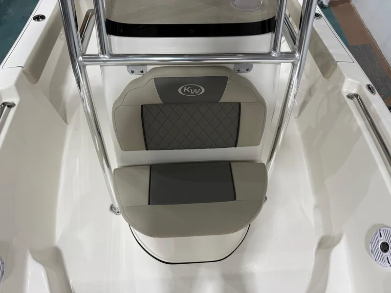Slide: The Image of 2025 Key West 189FS boat interior with cushioned seating and stainless steel frame. - 19