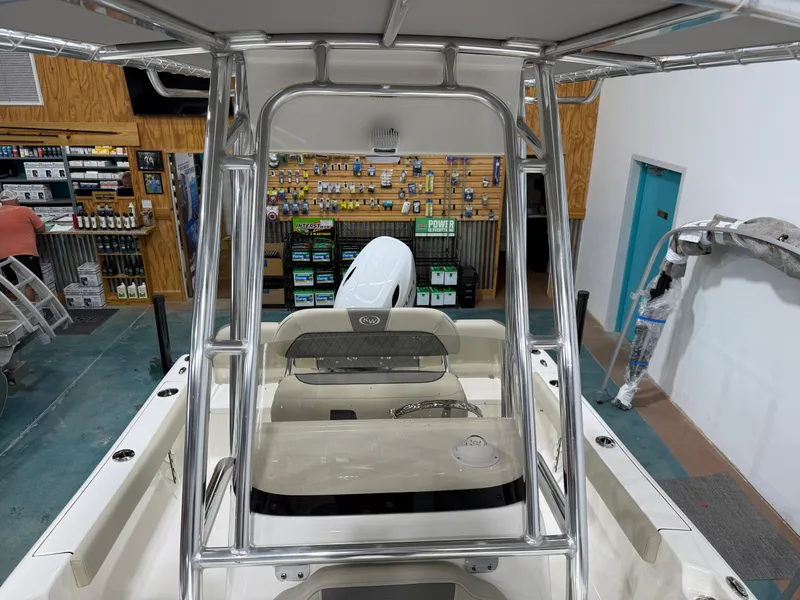 Slide: The Image of 2025 Key West 189FS boat interior in a showroom with accessories display. - 20